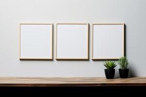 Three Posters Frame on a Wall and Wooden Table photo