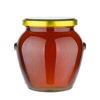 Tasty honey pot preserved, glass jar full of honey isolated on white background. photo