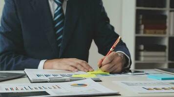 Team of business people working together in the meeting room office, teamwork background charts and graphs banner, double exposure successful teamwork,business planning concept. video