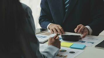 Team of business people working together in the meeting room office, teamwork background charts and graphs banner, double exposure successful teamwork,business planning concept. video