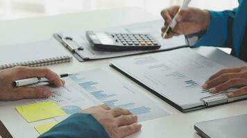 Team of business people working together in the meeting room office, teamwork background charts and graphs banner, double exposure successful teamwork,business planning concept. video