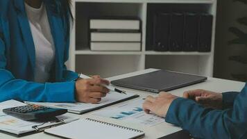 Team of business people working together in the meeting room office, teamwork background charts and graphs banner, double exposure successful teamwork,business planning concept. video