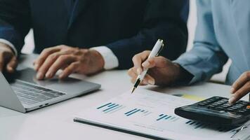 Team of business people working together in the meeting room office, teamwork background charts and graphs banner, double exposure successful teamwork,business planning concept. video