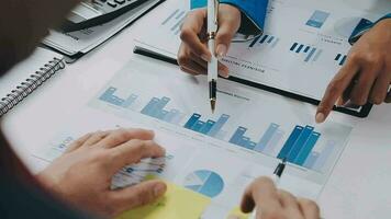 Team of business people working together in the meeting room office, teamwork background charts and graphs banner, double exposure successful teamwork,business planning concept. video