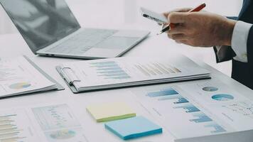 Team of business people working together in the meeting room office, teamwork background charts and graphs banner, double exposure successful teamwork,business planning concept. video