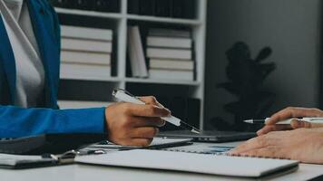 Team of business people working together in the meeting room office, teamwork background charts and graphs banner, double exposure successful teamwork,business planning concept. video