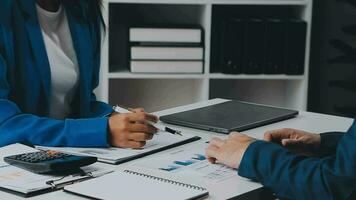 Team of business people working together in the meeting room office, teamwork background charts and graphs banner, double exposure successful teamwork,business planning concept. video