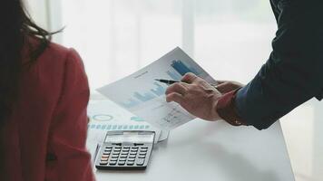 Close up of Business team analyzing income charts and graphs with modern laptop computer. Business analysis and strategy concept. video
