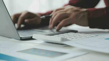 Close up of Business team analyzing income charts and graphs with modern laptop computer. Business analysis and strategy concept. video