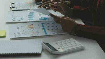 Close up of Business team analyzing income charts and graphs with modern laptop computer. Business analysis and strategy concept. video