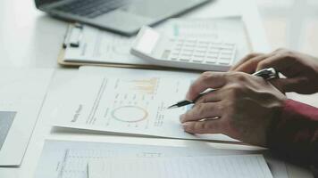 Close up of Business team analyzing income charts and graphs with modern laptop computer. Business analysis and strategy concept. video