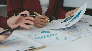 Close up of Business team analyzing income charts and graphs with modern laptop computer. Business analysis and strategy concept. video