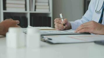 Doctor and patient are discussing consultation about symptom problem diagnosis of disease talk to the patient about medication and treatment method. video