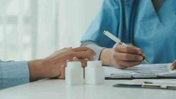 Doctor and patient are discussing consultation about symptom problem diagnosis of disease talk to the patient about medication and treatment method. video