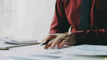 Business accounting concept, Business Man using calculator with computer laptop,pen, budget and loan paper in office. video