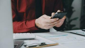 Business accounting concept, Business Man using calculator with computer laptop,pen, budget and loan paper in office. video