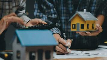 Image of team engineer checks construction blueprints on new project with engineering tools at desk in office. video