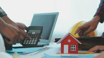 Construction and structure concept of Engineer or architect meeting for project working with partner and engineering tools on model building and blueprint in working site, contract for both companies. video
