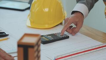 Construction and structure concept of Engineer or architect meeting for project working with partner and engineering tools on model building and blueprint in working site, contract for both companies. video