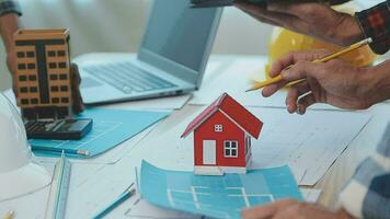Construction and structure concept of Engineer or architect meeting for project working with partner and engineering tools on model building and blueprint in working site, contract for both companies. video