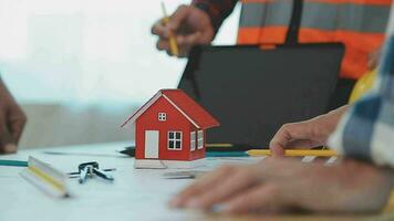 Construction and structure concept of Engineer or architect meeting for project working with partner and engineering tools on model building and blueprint in working site, contract for both companies. video