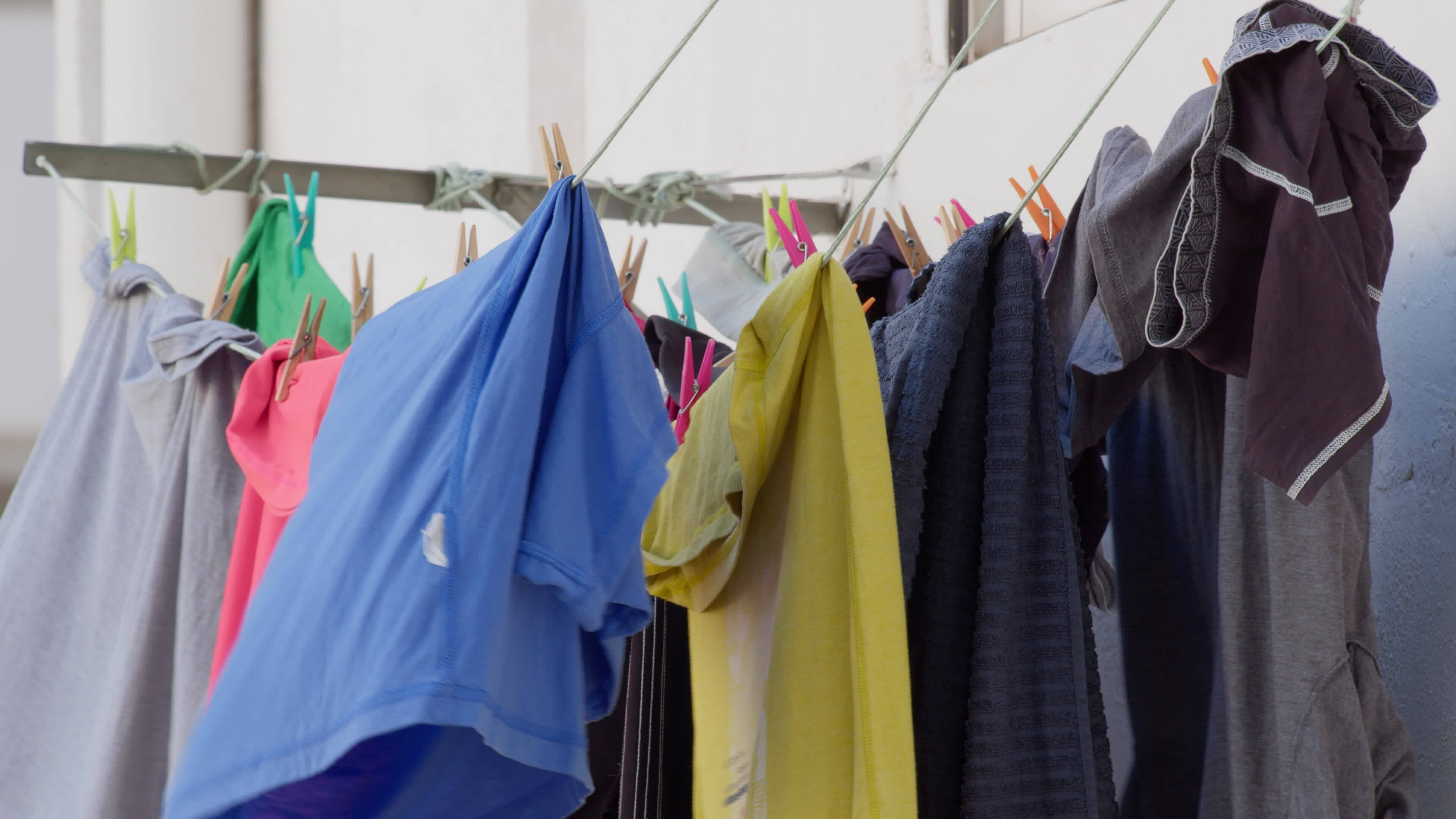 Colorful clothes drying outside 29254801 Stock Video at Vecteezy
