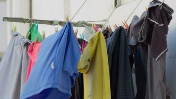 Colorful clothes drying outside video