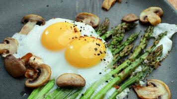 Mushrooms, asparagus, and scrambled eggs on a plate video