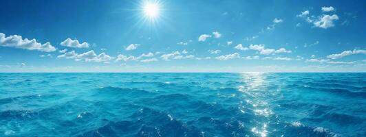 Blue ocean panorama with sun reflection, The vast open sea with clear sky, Ripple wave and calm sea with beautiful sunlight. AI generated photo