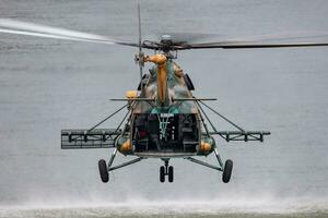 Untitled military helicopter at air base. Air force and army flight transportation. Aviation and rotorcraft. Transport and airlift. Military industry. photo