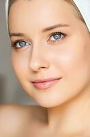 Skin care and beauty routine, beautiful woman with white towel wrapped around head, skincare cosmetics and face cosmetology photo
