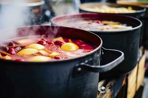 Beverages fruits and berries hot mulled wine in pots with steam in street food market. Generative AI photo