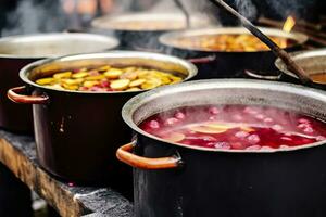 Beverages fruits and berries hot mulled wine in pots with steam in street food market. Generative AI photo