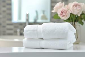 the world's softest towels against a minimalistic background. Stacked white towels sit on top of a soap dish in a bathroom. AI Generative photo