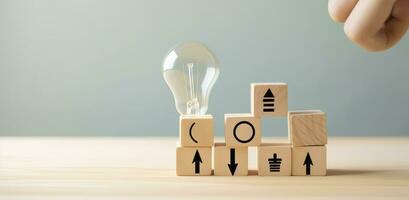 Creative idea, solution and innovation concept. Idea generation for business development. Wooden cube blocks with light bulb and cycle icons on clean background and copy space. AI Generative photo