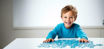 A triumphant child displaying a finished puzzle isolated on a white background photo