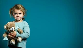 A child clutching a comfort toy tightly isolated on a blue gradient background photo