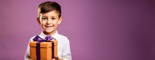 A child joyously holding a birthday present isolated on a vibrant gradient background photo