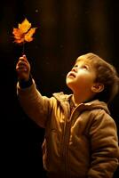 A child marveling at a leaf isolated on an autumn gradient background photo