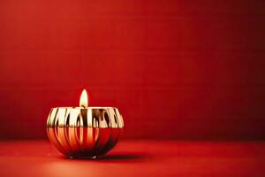 Golden mid-century candle holder with a glowing flame enhancing Christmas nostalgia isolated on a festive red gradient background photo