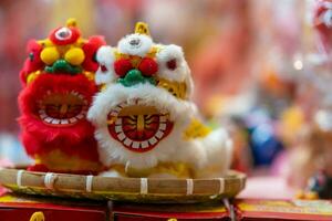 Decorated colorful lanterns hanging on a stand in the streets in Ho Chi Minh City, Vietnam during Mid Autumn Festival. Chinese language in photos mean money and happiness. Selective focus.