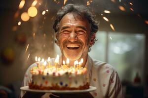 a man holding a birthday cake with several candles on bokeh style background photo