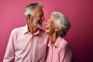 a elderly couple dancing happily and looking to each other in happiness photo