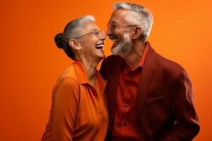 a elderly couple dancing happily and looking to each other in happiness photo