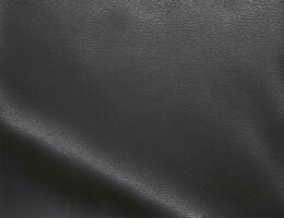 Black abstract background. Beautiful folds on shiny fabric or leather. Silk satin texture background for design. Elegant silver background. photo