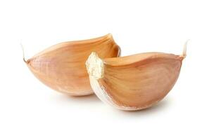 Two fresh unpeeled garlic cloves in stack isolated on white background with clipping path photo