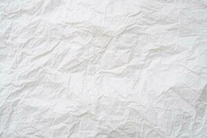 Wrinkled or crumpled white stencil paper or tissue after use in toilet or restroom with large copy space used for background texture in decorative art work photo