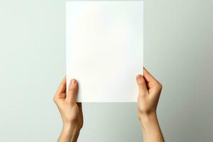 Empty canvas held Hands clutch blank paper, set against a white isolation AI Generated photo