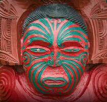 The cropped shot view of the traditional Maori wood carving statue in Civic square of Hastings, New Zealand. photo