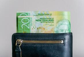 New Zealand currency 20 Dollars in the leather wallet. photo